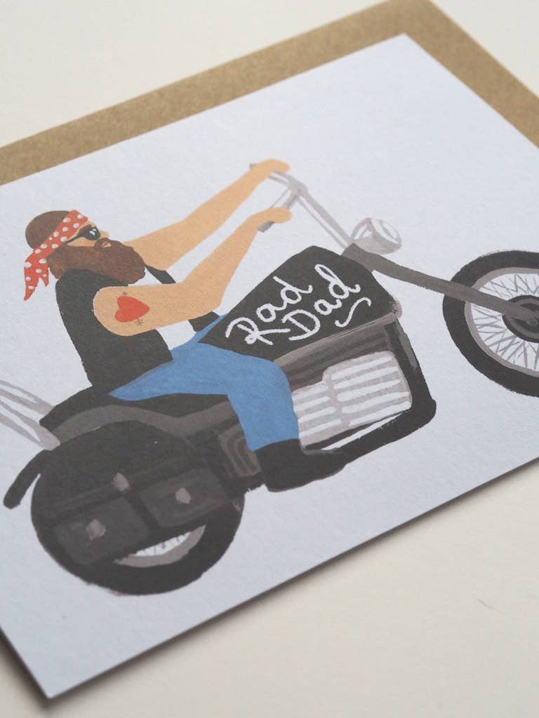 Card with illustration of a woman on a motorcycle wearing a bandana, with 'Rad Dad' text.