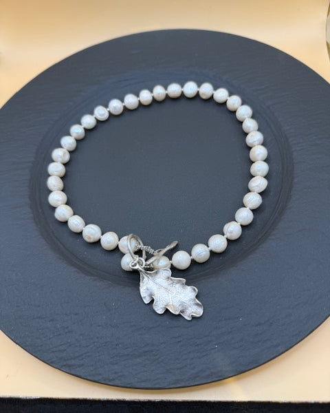 Freshwater pearl necklace with silver oak leaf
