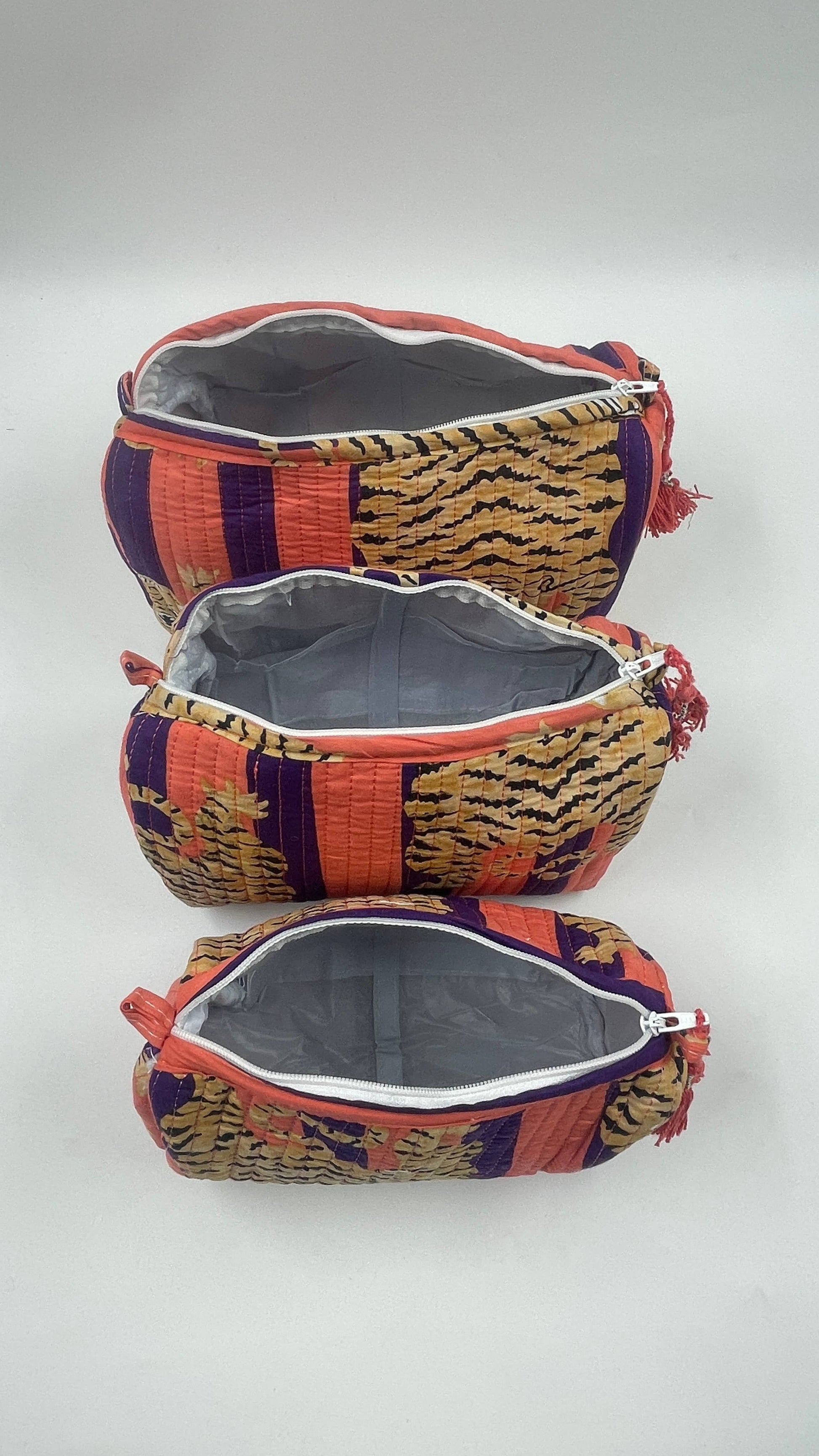 Tiger print cotton  quilted wash bag . Set of three