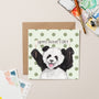 Father's Day card with a panda illustration on a polka dot background, surrounded by art supplies.
