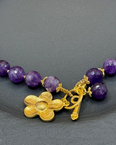 Purple faceted beads with gold flower necklace