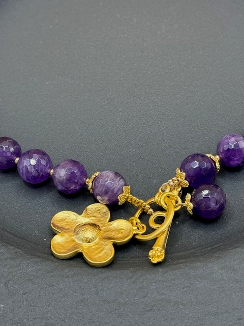 Purple faceted beads with gold flower necklace