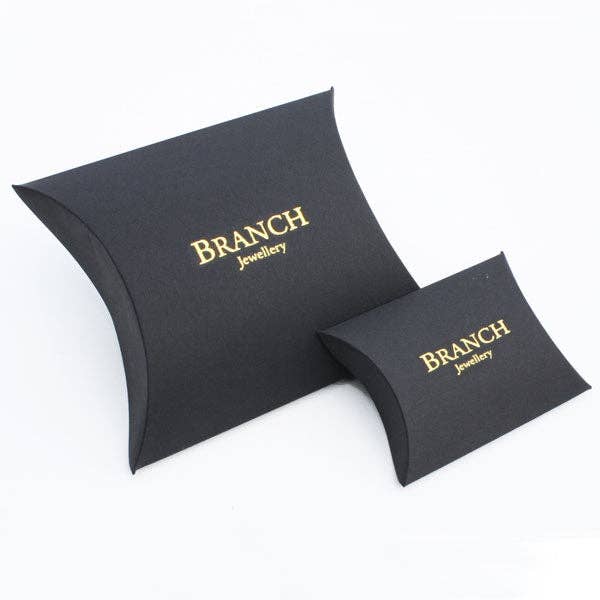 Black jewelry boxes with 'Branch Jewelry' branding on a white background