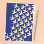 Blue card with yellow bird pattern on a pink background
