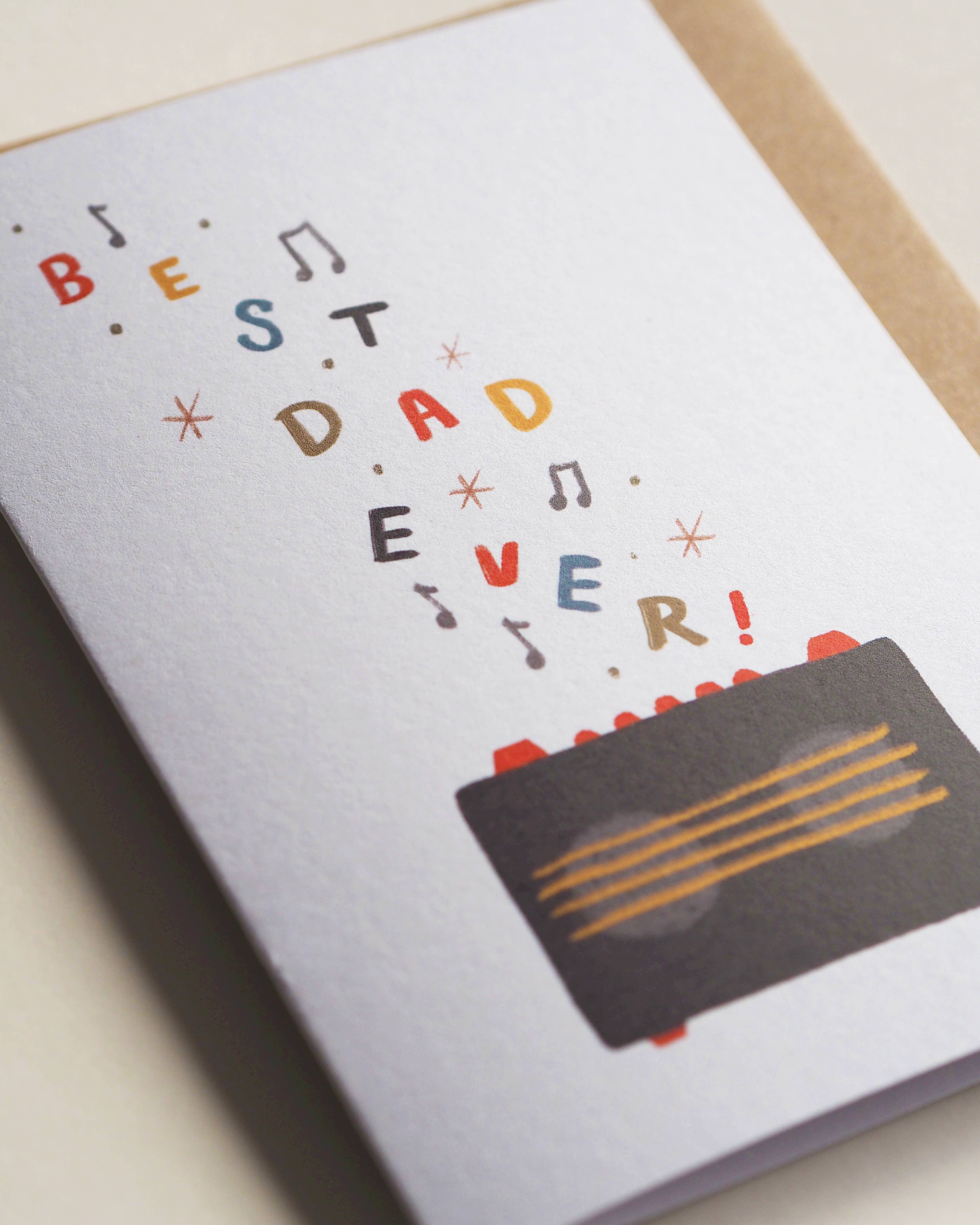 Greeting card with 'Best Dad Ever!' text and a cassette tape design on a light background