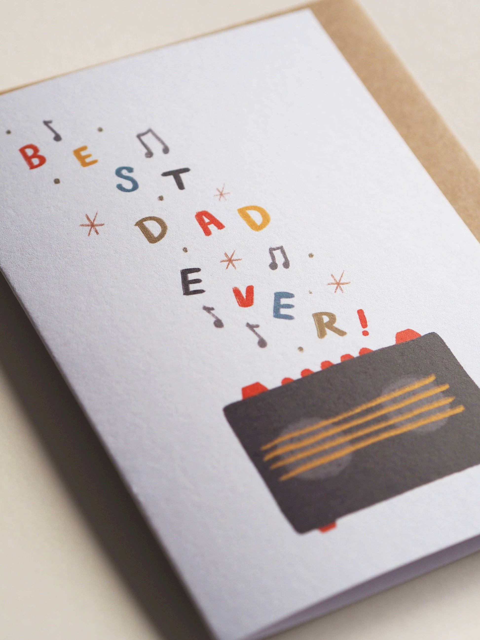 Greeting card with 'Best Dad Ever!' text and a cassette tape design on a light background