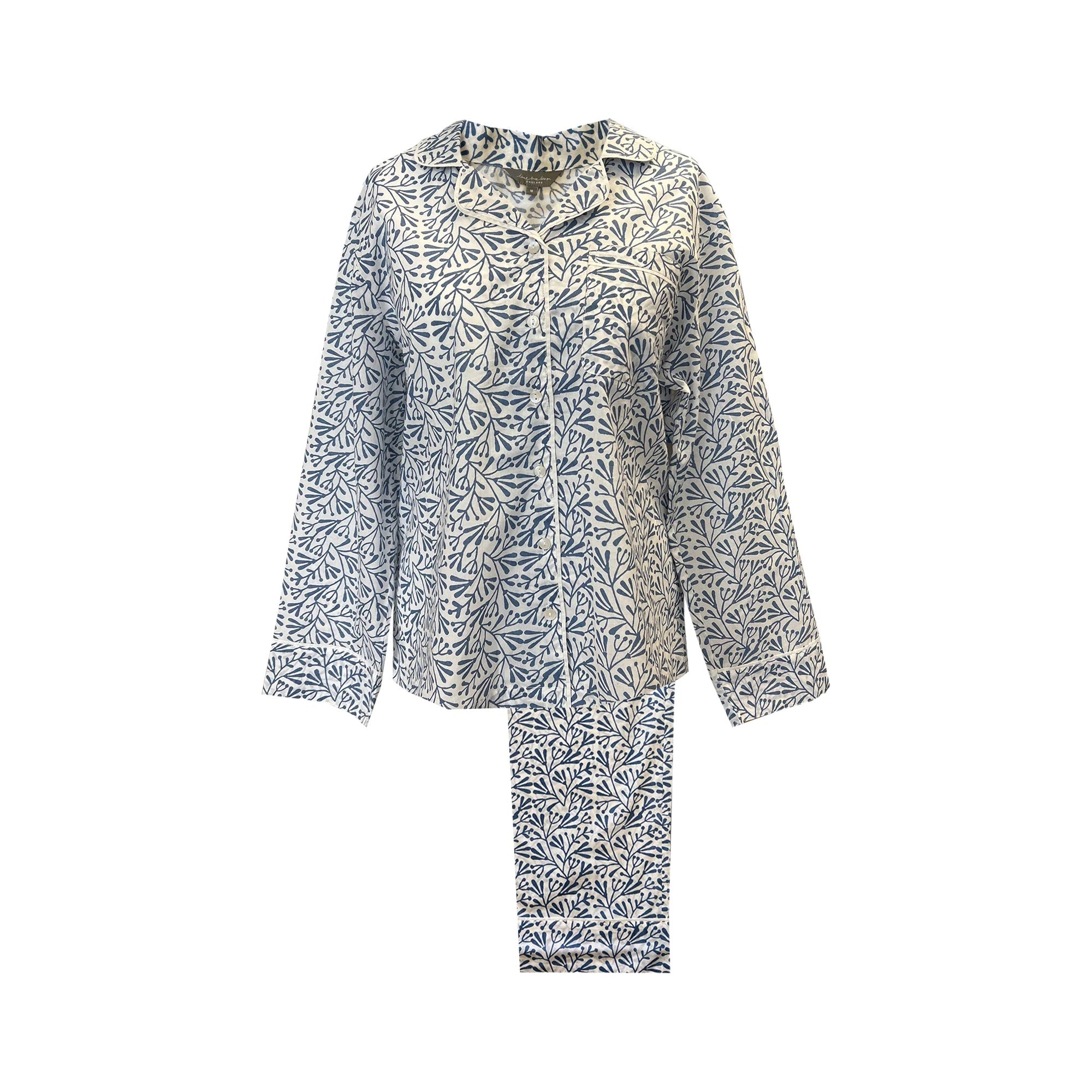 Floral patterned shirt and pants set on a white background