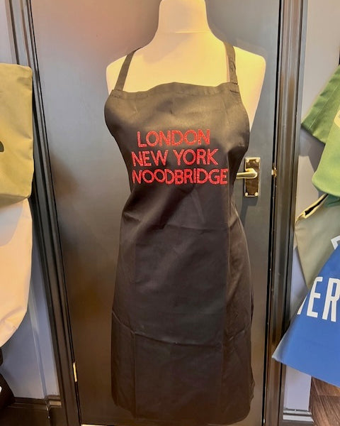 Black Apron, London New York Woodbridge Red Letters