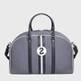 Gray duffel bag with black straps and a white number 2 on a light gray background
