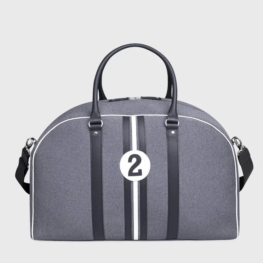 Gray duffel bag with black straps and a white number 2 on a light gray background