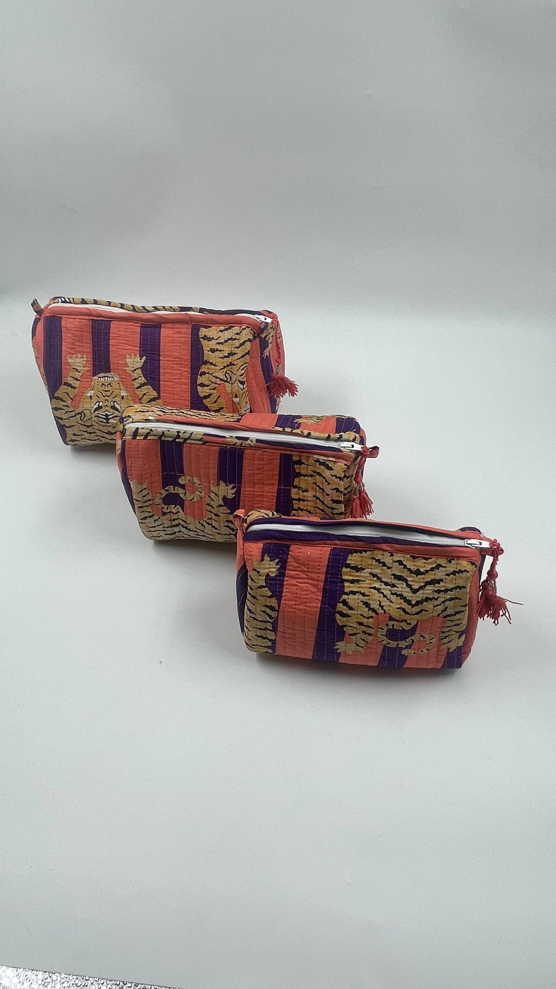 Tiger print cotton  quilted wash bag . Set of three