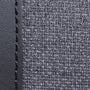 Close-up of gray fabric texture with a seam