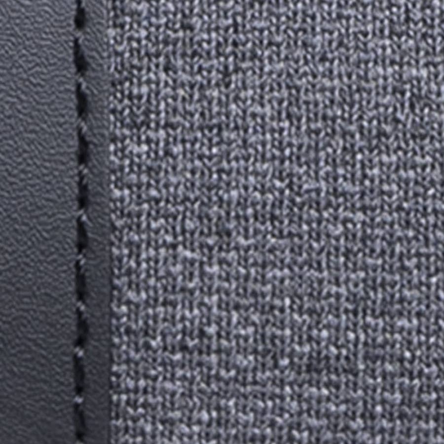 Close-up of gray fabric texture with a seam