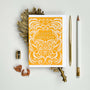 Orange and white birthday card with decorative patterns on a light gray background