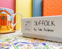 Product with 'SUFFOLK by Tim Bulmer' branding on a colorful background