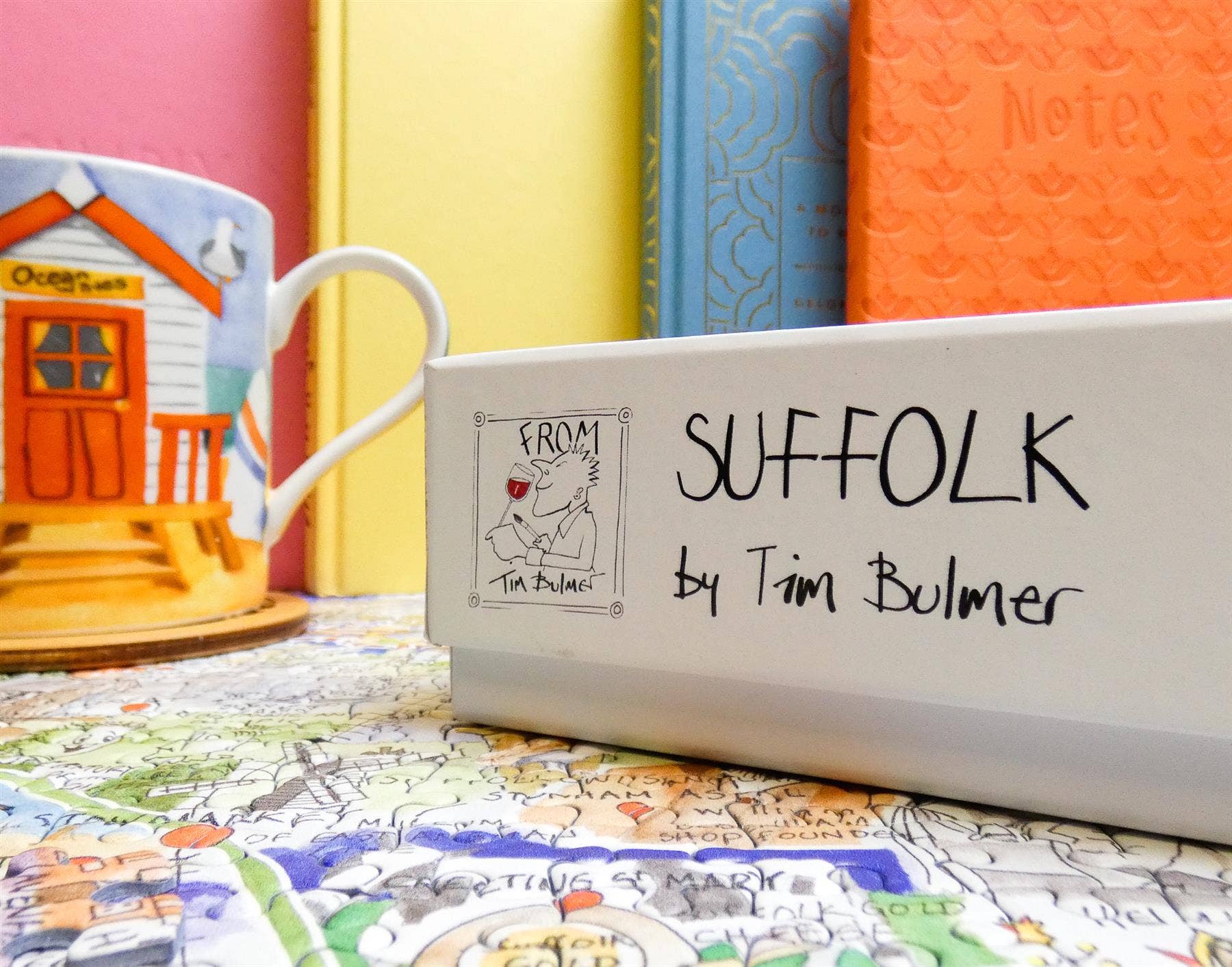 Product with 'SUFFOLK by Tim Bulmer' branding on a colorful background