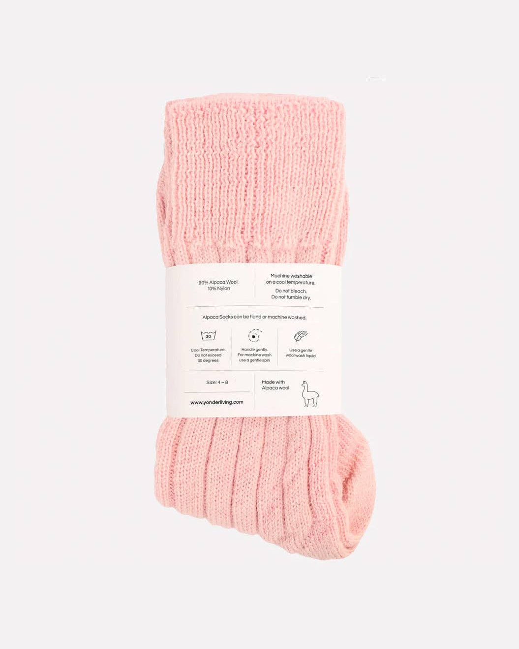 Pink socks with a label on a white background