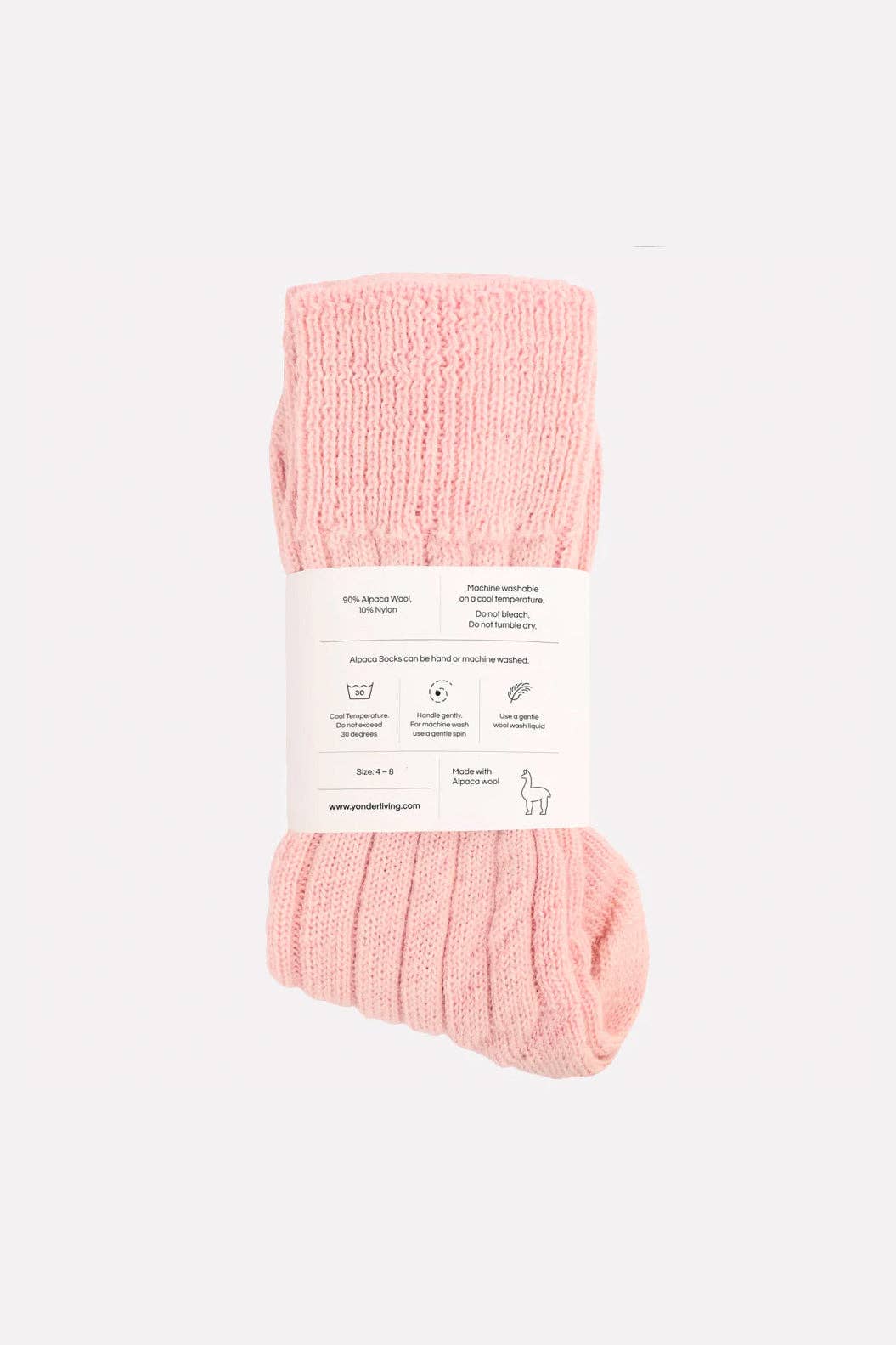 Pink socks with a label on a white background