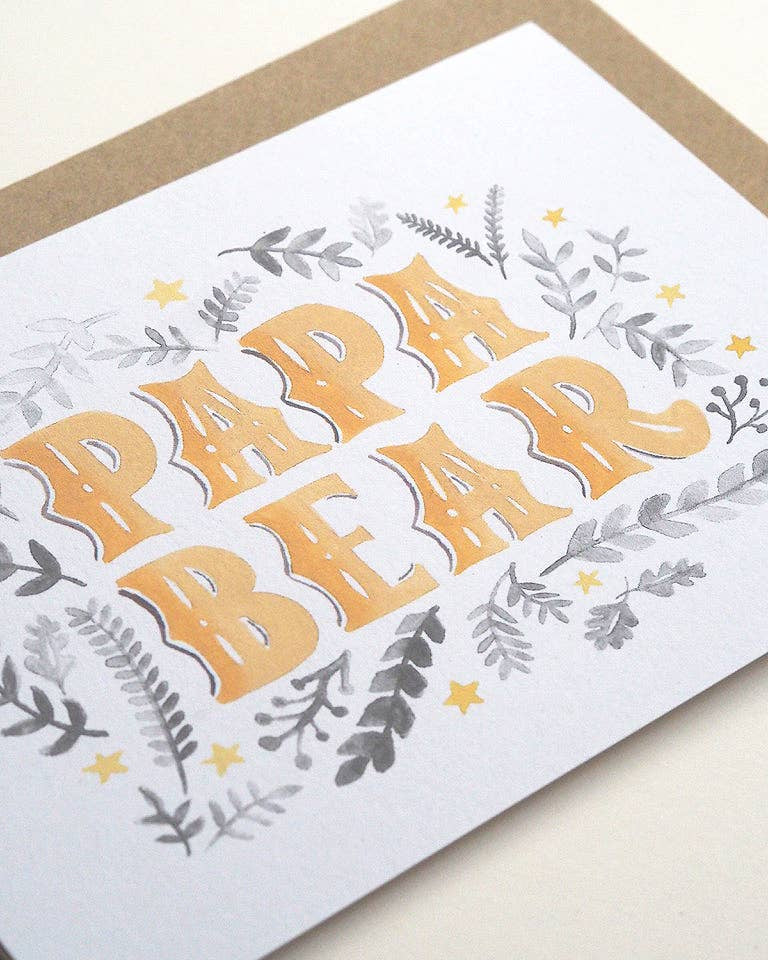 Greeting card with 'Papa Bear' text and floral designs on a white background