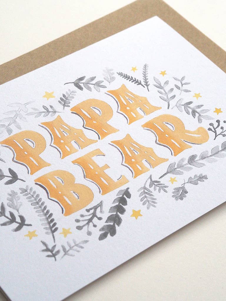 Greeting card with 'Papa Bear' text and floral designs on a white background