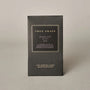 Black box with 'True Grace' branding on a beige background