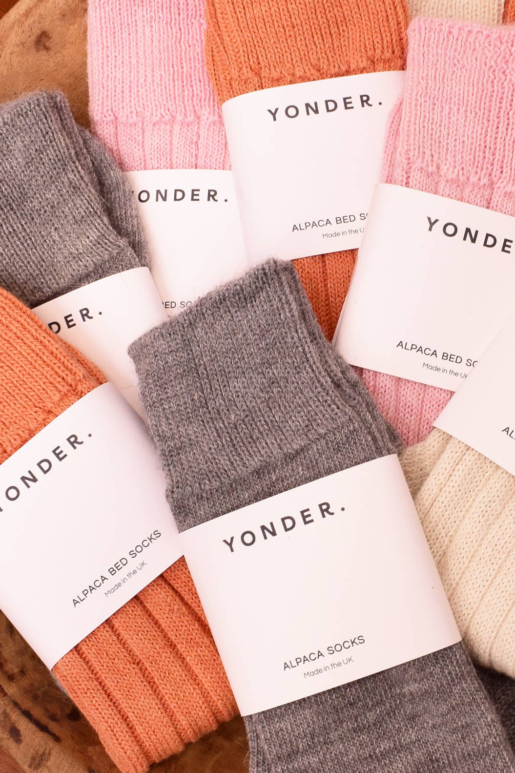 Yonder alpaca socks in various colors with visible labels.