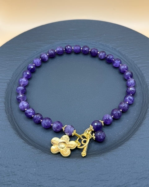 Purple faceted beads with gold flower necklace