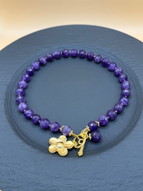 Purple faceted beads with gold flower necklace