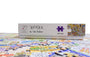 Jigsaw puzzle box labeled 'Suffolk by Tim Burton' with a partially completed puzzle on a white background.