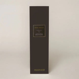 Black rectangular box with gold text on a light gray background