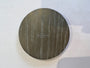 Round wooden coaster with a logo on a white background